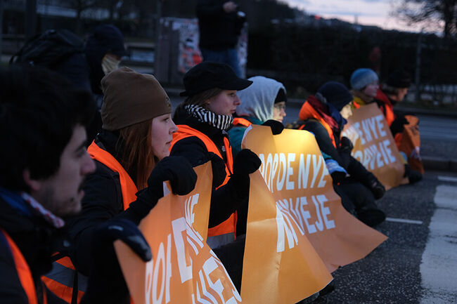 Climate activists holding a banner.