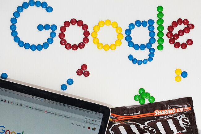 A Chromebook and the word Google written in M&M's