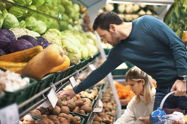 Couple shopping vegetables