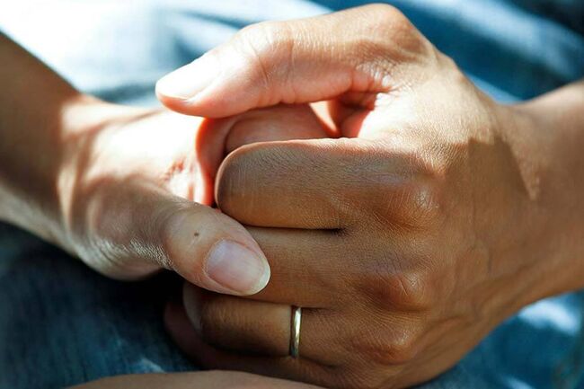 Two hands holding hands