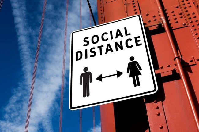 Sign illustrating social distance