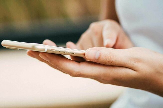 Close up of hands holding a smartphone