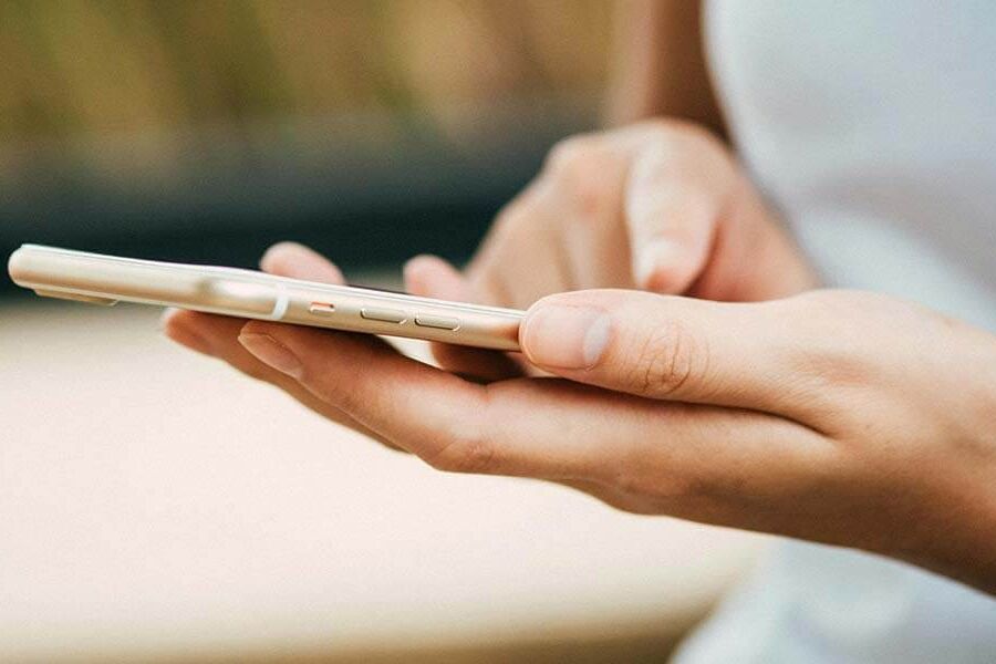 Close up of hands holding a smartphone