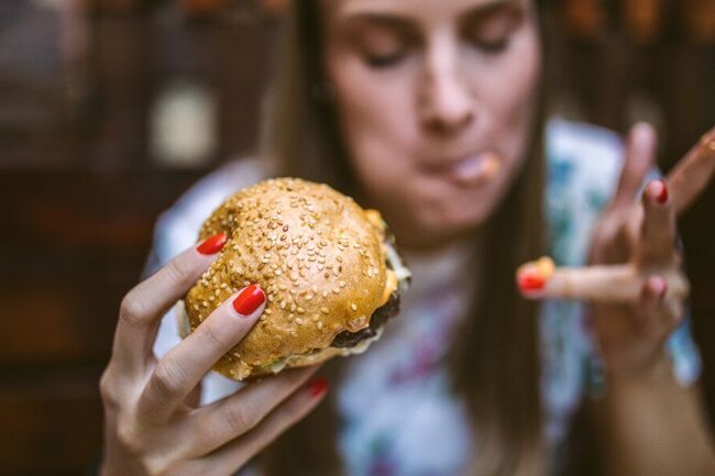 Woman with burger