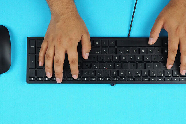 Hands by a keyboard.